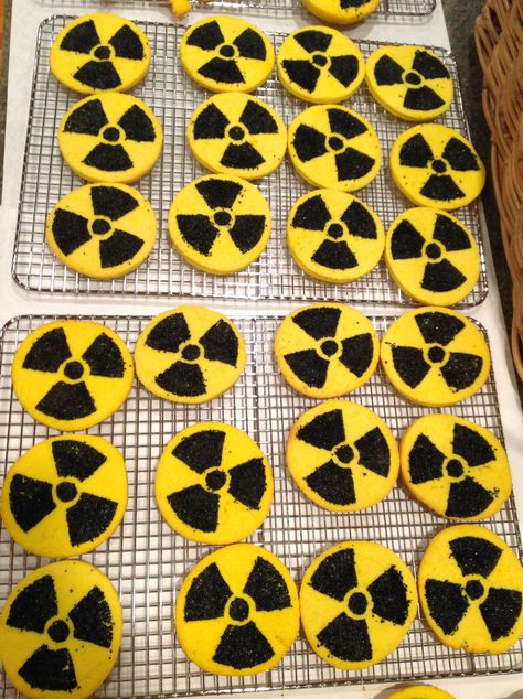 I made some yummy radioactive cream cheese cut out cookies for my Hubbies Godzilla themed birthday. I got an image of the radioactive symbol from the internet and made a stencil from an old plastic lid from a deli container. It is the same kind of plastic lid that is on coffee cans. I kept the lip of the lid up so the sugar wouldn't spill off of the lid. I lightly pressed the plastic stencil into the dough and rubbed the sanded sugar into the cookie dough then baked. Essen, Toxic Waste Birthday Party, Radioactive Birthday Party, Radioactive Party Ideas, Biohazard Birthday Party, Xenomorph Birthday Party, Apocalypse Theme Party, Radioactive Party, Fallout Wedding