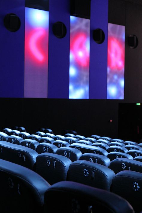 How can innovative lighting design transform cinema? Connected lighting synchronized with the screen creates a wholly immersive experience for movie-goers at the ICE Cinema in Blagnac, France. Pass the popcorn! #lightingdesign #innovation #luminousmagazine (Architect: ABP Architectes, luminaires: Philips Luminous Textile panels and Color Kinetics LED black lights, photo c CGR Cinemas) Schiphol Airport, Black Lights, Stadium Lighting, Photo C, Light Architecture, Immersive Experience, The Ice, Black Light, Light And Shadow