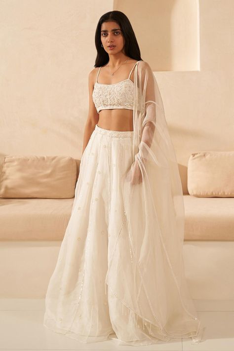 Off white embroidered lehenga set for women Off White Lengha Design, Simple White Lengha, Strap Blouses For Lehenga, Sleeveless Lehenga Designs, Sleeveless Lengha Blouse, White Lehenga Design, White Sequin Lehenga, Spaghetti Strap Lehenga, Light Lehenga Simple