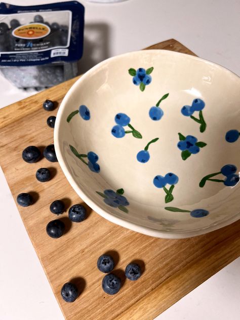 Ceramic bowl painted with blueberries #ceramics #painting #diy #diyideas #fruit #bowl Fruit Plates Ceramics, Diy Bowl Painting Ideas, Cute Ceramic Bowls Design, Berry Ceramic Bowl, How To Paint A Blueberry, Fruit Bowl Pottery Ideas, Fruit Bowls Ceramic Pottery, Pottery Painting Ideas Blueberries, Pottery Painting Bowls Ideas