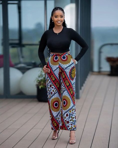 Ankara Styles 2022: Beautiful Trouser Outfit for Ladies. - Ladeey Trouser And Top For Ladies, Ankara Trouser, Outfit For Ladies, Ankara Pants, Print Flare Pants, Ankara Trousers, Trouser Designs, Ankara Styles For Women, Bell Pants