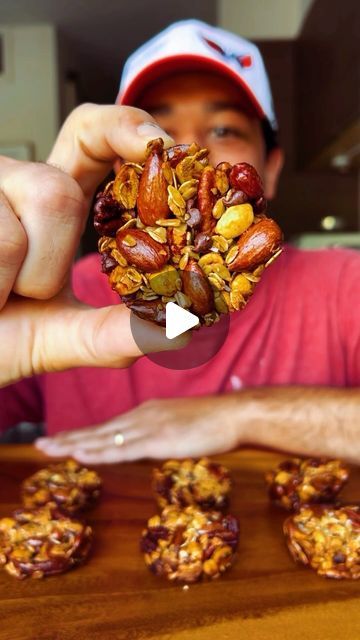 Misha on Instagram: "Yummy High Protein Granola Cups 😋  Ingredients:  - Raw Oats (1 cup)  - Peanuts (1 cup) - Almonds (1 cup) - Pecans (1 cup) - Sunflower Seeds (1 cup)  - Mini Chocolate Chips (1 cup)  - Honey or Maple Syrup (3/4 cup - *edited from the original 1/2 cup since some people had issues with the granola binding together*) - Flaky Salt (1 teaspoon)  - Canola or Coconut Oil (for greasing muffin tin)  Directions:  1. Preheat oven to 325°F 2. Combine all ingredients minus the salt and oil into a large bowl and fold with a rubber spatula until everything is evenly coated with the honey 3. Grease each individual muffin tin with oil spray (a couple sprays per cup) 4. Tightly pack around 1.5 tablespoons of the mixture into each muffin tin then bake for 25 minutes 5. Sprinkle with flaky Healthier Granola Cups, Nut Protein Bar, Granola Cups Recipes, High Protein Granola, Granola Cups, Nut Cups, Raw Oats, Protein Granola, Healthy Protein Snacks