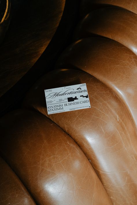 Leather seat mockup with a business card, 85x55mm, showcasing design versatility for print templates, ideal for designers seeking realistic mockups. High quality mockup brought to you by Bendito Mockup. This mockup will allow you to craft a beautiful and aesthetic presentation of your work. What's included: • Created for Adobe Photoshop • Dimensions - 4000px x 6000px / 300 dpi • Download file - 68MB Sagmeister And Walsh, Graphic Design Mockup, Classic Film Noir, Mockup Creator, Professional Business Card Design, Diy Business Cards, Digital Business Card, Visual Identity Design, Stationery Mockup