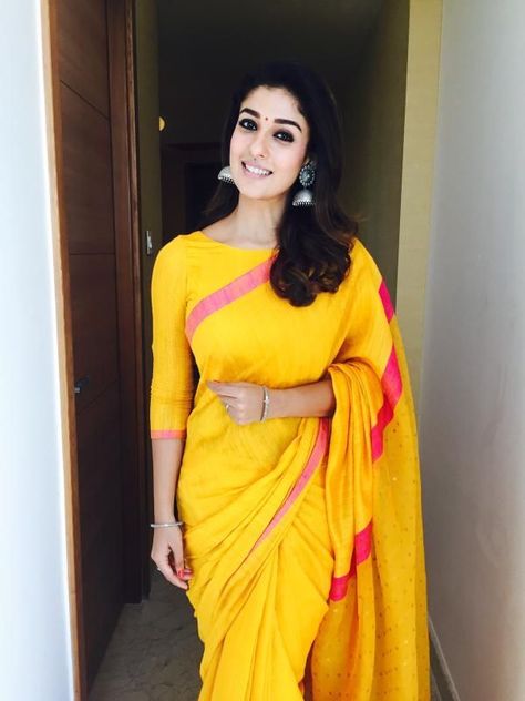 Nayanthara at the opening of Salem Kalyan Silks in a Yellow raw silk saree with contrast pink borders paired with 3/4 sleeves boat neck blouse Haute Couture, Simple And Elegant Saree Look, Elegant Saree Look, Sari Design, Mango Blouse, Pink Border, Simple Sarees, Elegant Saree, Blouse Design Models
