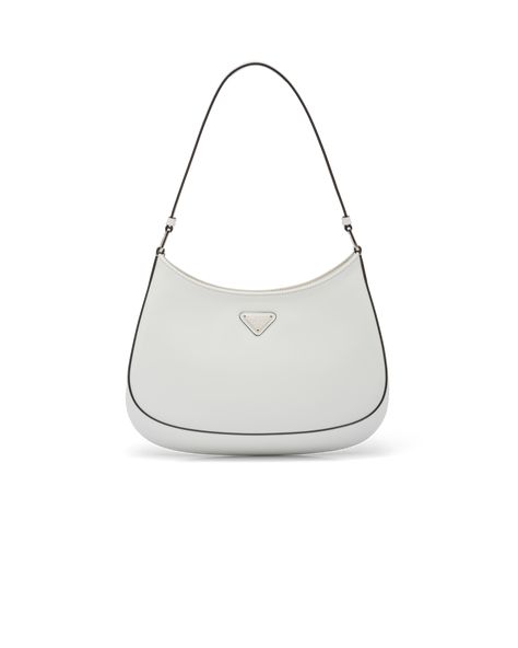 Brushed leather Leather handle Metal hardware Logo on enameled metal triangle at the front Magnet closure Prada logo nylon lining with patch pocket Prada Cleo Brushed Leather Shoulder Bag, Prada White Bag, White Prada Bag, Aesthetic Shoulder Bag, 90s Bag, Prada Cleo, Prada Purse, Prada Purses, Hardware Logo