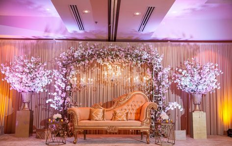 A beautiful cherry blossom arch with shimmering crystal drops and crystal chandeliers - A stage worth a second glance... and a third! 👀  See more of our décor at www.shaadicreations.com! Photography: Joseph Kang Photography #chicagoindianwedding #indianwedding #weddingdress #wedding #bride #groom #bridesmaids #southasianbride #shaadi #indianbride #luxury #love #punjabisuits #punjabiwedding #destinationwedding #weddingphotography #weddingmakeup #weddinginspiration #weddingidea #southasianbride Debut Stage Design, Debut Decorations 18th Diy, Debut Stage Decoration, Shaadi Stage, Stage Backdrop Wedding, Cherry Blossom Arch, Stage Decorations Wedding, Japanese Wedding Theme, Debut Decorations