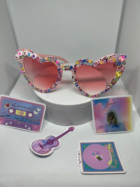 Lover inspired bejewelled sunglasses perfect for any Swiftie going to the The Eras Tour!  Please feel free to message me with any questions or requests for a custom order of your favourite song/album :) Eras Sunglasses, Eras Tour Sunglasses, Eras Tour Earrings, Concert Sunglasses, Lover Eras Tour, Swiftie Party, Eras Tour Taylor, Personalized Lanyards, Favourite Song