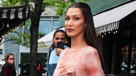 Bella Hadid exudes retro glam in flowy pink dress Hotel With Boyfriend, Flowy Pink Dress, Vintage Roberto Cavalli, Gold Sandals Heels, Yellow Wrap Dress, The Bowery Hotel, Bowery Hotel, Roberto Cavalli Dress, Black Cowboy Hat