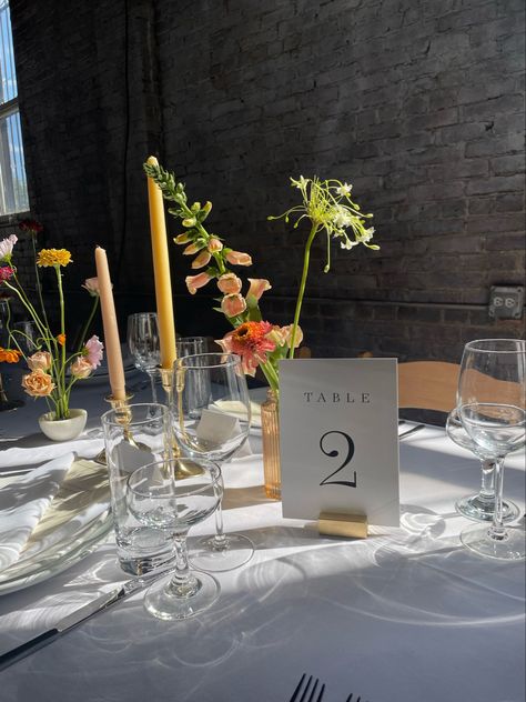 Simple Small Wedding Table Decor, Vibrant Minimalist Wedding, Bud Vases And Tall Candles, Bud Vases And Votives Wedding Centerpiece, Fall Flower Bud Vase, Summer Table Wedding Decor, Bus Vases Wedding Table, Colored Tapered Candles Wedding, Wildflower Tablescape Round