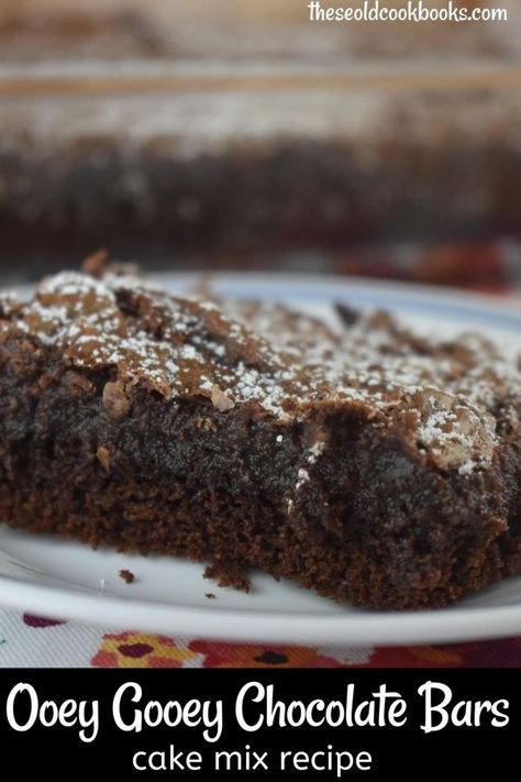 Chocolate Cake Mix Gooey Bars are a chocolate-lovers delight. This six ingredient cake mix recipe has a brownie bottom with an ooey gooey fudge layer on top. Chocolate Cake Mix Gooey Bars Recipe - These Old Cookbooks Pie, Poet Gooey Chocolate Cake, Ooey Gooey Chocolate Bars, Chocolate Ooey Gooey Bars, Triple Chocolate Fudge Cake Mix Recipes, Obey Gooey Bars, Desserts Using Chocolate Cake Mix Boxes, Dark Chocolate Fudge Cake Mix Recipes, Devils Food Cake Mix Recipe Ideas Easy