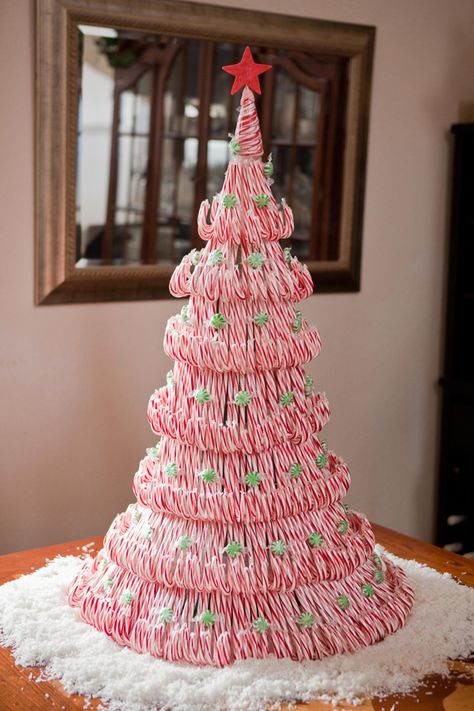 Candy Cane Christmas Tree - WomansDay.com Candy Cane Crafts, Candy Cane Decorations, Candy Christmas Tree, Candy Cane Christmas Tree, Tree Centerpieces, Christmas Table Centerpieces, Alternative Christmas, Alternative Christmas Tree, Candy Crafts