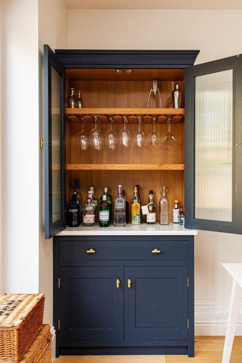 Read all about this project's bespoke kitchen cabinetry, including this breakfast larder with bifold doors and a bespoke drinks dresser featuring reeded glass cabinetry doors😍😍😍 Bespoke Bar Cabinet, Dresser Glass Doors, Glass Drink Cabinet, Welsh Dresser Drinks Cabinet, Glass Stand In Kitchen, Drinks And Glasses Cabinet, Bespoke Drinks Cabinet, Kitchen Drinks Cabinet Bar Ideas, Dining Room Bifold Doors