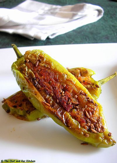 Aloo Stuffed Chilli Peppers | Bharwa Mirch 8-10 long thick light Green chillies/Poblano peppers(bajji variety with less spice)  4 Potatoes,boiled and peeled  2 tbsp besan  1 Onion,finely chopped  2-3 tbsp chopped Coriander  1/2 tsp Red chili powder  1/2 tsp Garam masala  1/2 tsp Coriander powder  1/2 tsp Amchur powder  1 tsp Lemon juice  1 tsp Saunf  1 tsp Jeera  1/2 tsp Ajwain  a pinch of hing  Oil to shallow fry  Salt to taste Stuffed Chillies Recipe, Aalu Bhajiya, Desi Khana, Veg Curry, Chilli Peppers, Poblano Peppers, Chilli Recipes, Indian Vegetarian, Desi Food