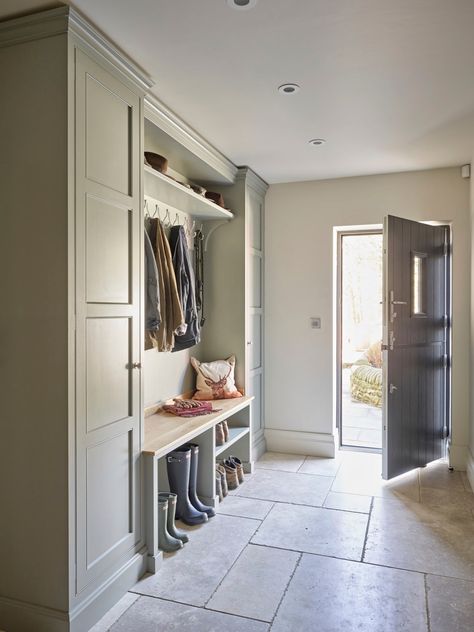 We can’t predict the weekend weather, but we can recommend a boot room. You don’t have to live in a mansion to create a space that keeps muddy wellies, coats and the kids’ shows neat and tidy and the rest of the house clean.⁠ This fabulous boot room features bespoke cabinetry with walnut wood details by #thesecretdrawer, is finished in #blueblood from @paintandpaperlibrary and a reclaimed slate floor. ⁠ ⁠ 📸 | @nickyarsley ⁠ Dröm Hus Planer, Oak Bench Seat, Boot Room Utility, Natural Stone Floor, Hallway Seating, Utility Room Designs, Mud Room Entry, Large Hallway, Mudroom Decor