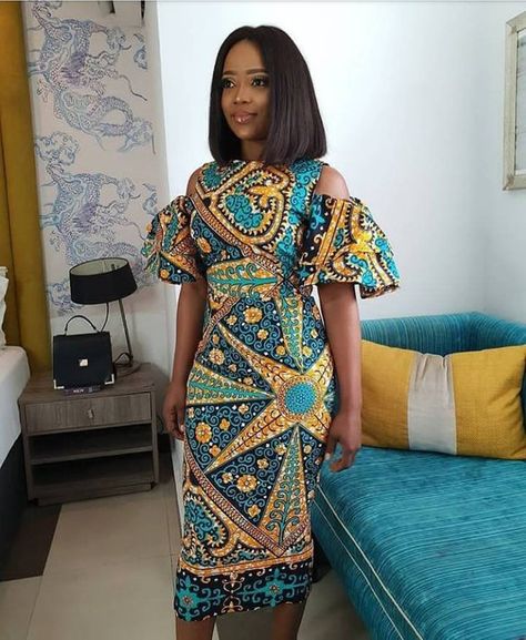 Latest Ankara Styles, Ankara Cold Shoulder Dress. https://www.etsy.com/listing/612947176/ankara-slim-fit-cold-shoulder-dress Moda Afro, African Party Dresses, Ankara Long Gown Styles, Ankara Dress Styles, African Fashion Designers, African Dresses Modern, Afrikaanse Mode, Ankara Gown Styles, African Fashion Modern