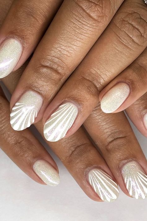 Bring the beach to your fingertips with these 12 stunning seashell nail designs! Whether you prefer subtle accents or bold statements, these designs are perfect for adding a touch of ocean-inspired beauty to any look. Ocean Nail Art, Seashell Nails, Wave Nails, Beach Nail Designs, Baby Nails, Summery Nails, Pearl Nails, Nail Designs Glitter, Beach Nails