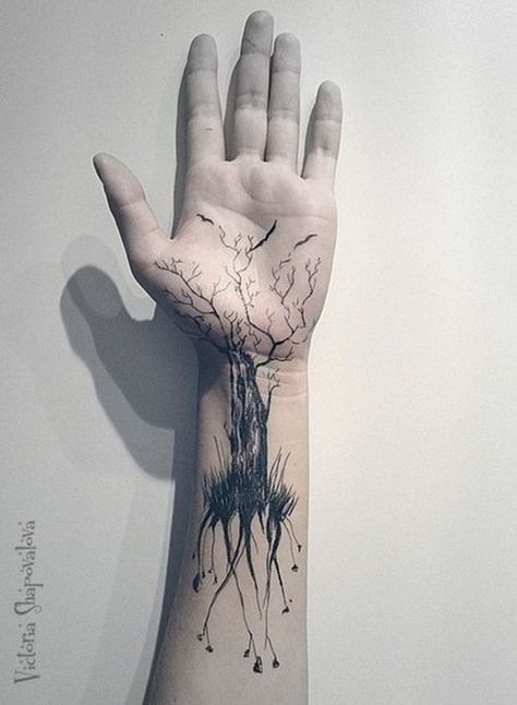 This artistic design stretches from the mid-forearm up to the lower portion of the palm of the hand. It shows a tree, completely in black, from the roots to the trunk to the bare branches. #tattoos #tattoofriday #tattooart #tattoodesign #handtattoosideas #coolhandtattoos #handtattoosboy #handtattoospictures #simplehandtattoos #handtattoodesignsforguys Wrist Tree Tattoo, Hand Tattoos Pictures, Wrist Tattoos For Men, Tattoo Main, Tree Roots Tattoo, Roots Tattoo, Tattoo Tree, Tree Tattoo Small, Cool Wrist Tattoos