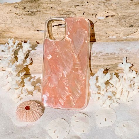 Carry a reminder of the sea with you wherever you may go with this gorgeous shimmering Peach Seashell Phone case. The Tough Case is encased in polycarbonate ~ the strongest plastic available for maximum drop protection. Each seashell is unique and will vary slightly in color. Makes the perfect gift for any occasion. Regular slim case offers moderate protection. ⭐️ SALE: No Returns, Refunds or Exchanges on Discounted Items *Impact, Drop, Shatter and Shock Resistant *Precise cut outs for connectiv Peach Iphone Case, Cute Iphone 12 Mini Cases, Seashell Iphone Case, Seashell Phone Case, 12 Mini Iphone, 12 Pro Max Iphone, Pretty Phone Cases, Iphone Accessories, Cute Phone Cases