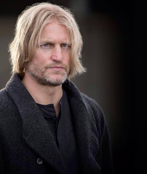 Haymitch is district 12's mentor. He is to train Peeta and Katniss to fight in the games. Haymitch is an alcoholic and, at first, puts in no effort. When he realizes Peeta and Katniss are fighters, he tries to help them. He encourages Katniss to go with Peeta's story because he has made her "desirable". Haymitch Abernathy, New Hunger Games, Hunger Games Characters, Fire Movie, Hunger Games Movies, Katniss And Peeta, Hunger Games 3, Hunger Games Series, Peeta Mellark