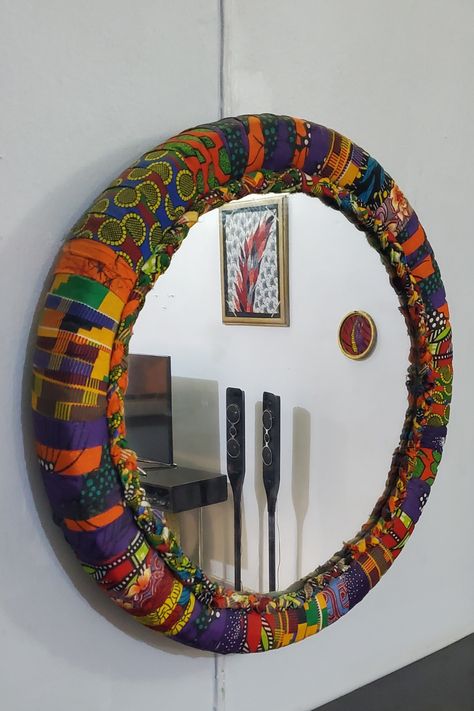 Motorcycle tire-inspired wall decor crafts Coban, Ankara Home Decor Ideas, Ankara Wall Decor, African Room Decor Ideas, Diy African Decor, African House Decor, African Fabric Accessories, Draps Design, African Wall Decor