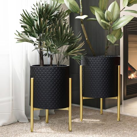 PRICES MAY VARY. A geometric diamond-shaped pattern offers a stylish look to the planter pots, while the gold stands give it a luxury contemporary vibe. Each gold stand is sturdy and will securely hold metal cachepots while the stand foot pad designs protect floor to prevent any scratches or scuffs. Crafted from durable iron, all metal cachepot planter set includes 1 large cachepot, 1 small cachepot, and 2 gold stands. Decorative planter set: these metal planter pots have no drainage holes; leav Gold Planter, Geometric Diamond Pattern, Black Planters, Modern Plant Stand, Metal Plant Stand, Floor Plants, Luxury Contemporary, Modern Planters, Planter Stand