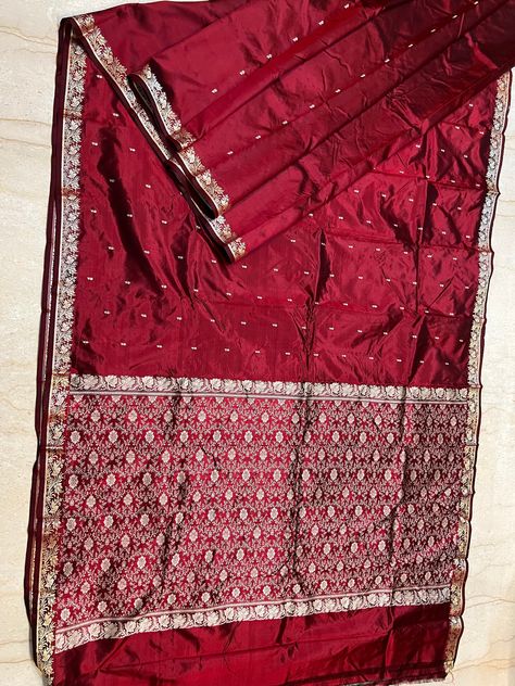 Beautiful  pure katan silk Resham woven  banarasi saree .   Presenting a  pure double warp handloom  maroon dual tone  ( red & black ) katan silk  Banarasi   saree perfect for wedding or party . Has beautiful floral resham  butas on all over the body and a gorgeous border and  pallu . The saree has falls and pico done. An unstitched blouse fabric is included. The saree is Silk Mark Certified to attest to the purity of silk used in the base fabric. Beautiful tassel work also done to make the saree more gorgeous ! Red Banarasi Saree, Engagement Saree, Maroon Colour, Silk Banarasi Saree, Resham Work, Katan Silk, Banarasi Saree, Banarasi Sarees, Maroon Color