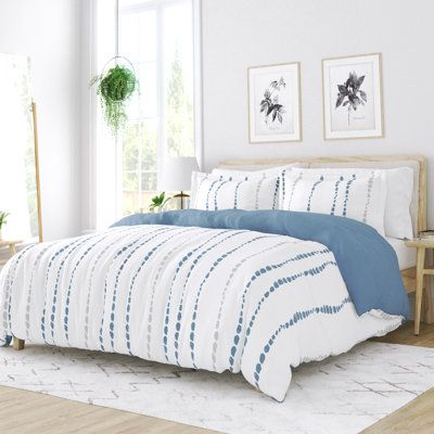 Anchor your bedroom in boho style with this reversible bedding set. This microfiber set is made from 100% polyester in a muslin weave, and it comes with one duvet cover and two pillow shams (one for the twin size). One side boasts a solid, gray-blue hue, and the other features a striped, dotted pattern over a white background. We love that this set is moisture-wicking, so it's great for warm sleepers. It also features corner ties and a zipper closure to help keep your duvet or insert (sold separ Patterned Duvet, Reversible Bedding, Twin Duvet Cover, High Quality Bedding, Reversible Duvet Covers, Duvet Cover Pattern, Down Comforter, Duvet Covers Twin, Twin Duvet