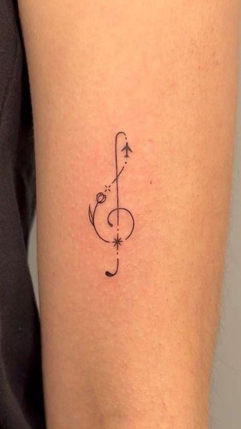 Harmony in Ink: Music notes tattoo ideas. Explore designs that capture the rhythm and melody of your favorite tunes in a timeless and artistic symphony. Music Note Tattoo Ideas, Tatoo Music, Small Music Tattoos, Violin Tattoo, Notes Tattoo, Music Notes Tattoo, Timeless Tattoo, Henna Inspired Tattoos, Music Note Tattoo