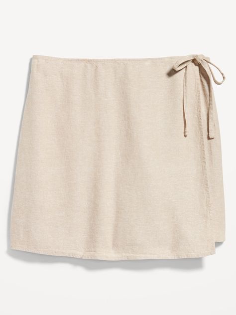 functional side-tie elasticized back waist wrap front pull-on style sits at belly button relaxed a-line fit 5" inseam models are approx.  5'9" and wear sizes s (4), l (12), and xl (18) Linen Wrap Skort, Linen Wrap Skirt, White Knee Length Skirt, Navy Mini Skirt, Wrap Skort, Wrap Shorts, Womens Mini Skirts, Jupe Short, Women Short Skirt