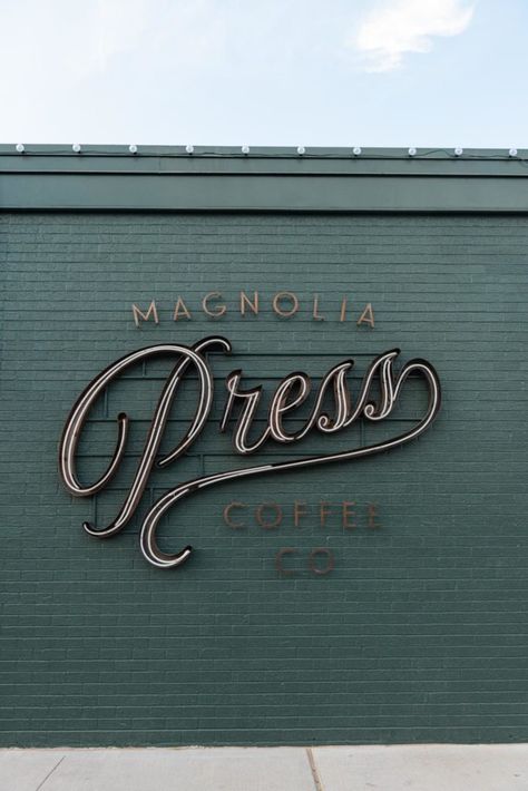 A Look Inside Magnolia Press with Chip & Joanna Gaines | Magnolia Press | Waco, TX | magnolia.com | Speakeasy Exterior, Campground Signs, Magnolia Press, Magnolia Journal, Opening A Coffee Shop, Store Signage, Cozy Coffee Shop, Shop Signage, Green Paint Colors