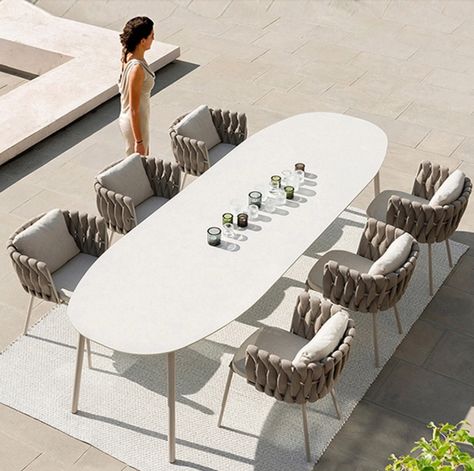 This practical, contemporary patio furniture set is complete with a oval, white marble-topped garden table, , six cushioned rope-effect chairs , which is integrated into the table. With clean lines and an attractive finish, it combines comfort and practicality the seats are comfortable yet supportive and the spinning centrepiece puts the condiments in everyone's reach, ideal for lunch parties or afternoon tea! Woven Outdoor Furniture, Outdoor Dining Table Setting, Family Togetherness, Patio Table Set, Esstisch Modern, Outdoor Tables And Chairs, 카페 인테리어 디자인, Balcony Furniture, Mesa Exterior