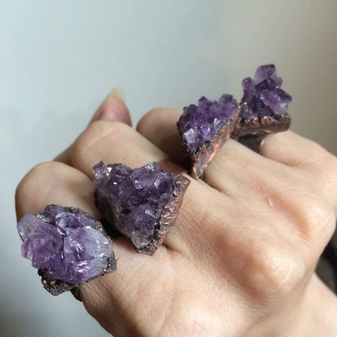 "Amethyst druzy ring | Amethyst crystal ring | Purple druzy crystal ring | Raw crystal jewelry | Raw amethyst crystal statement ring PLEASE NOTE: We are slowly phasing out this style, so we are only offering the sizes listed in the drop down, as these rings are pre-made and ready to ship. This listing is for one druzied amethyst crystal electroformed to a hand-hammered wide band recycled copper ring. If your size is unavailable, please select \"custom\" from the drop down menu and indicate the s Raw Amethyst Crystal, Raw Crystal Ring, Ring Purple, Raw Crystal Jewelry, Druzy Necklace, Jewels Rings, Jewelry Boutique, Druzy Crystal, Raw Amethyst
