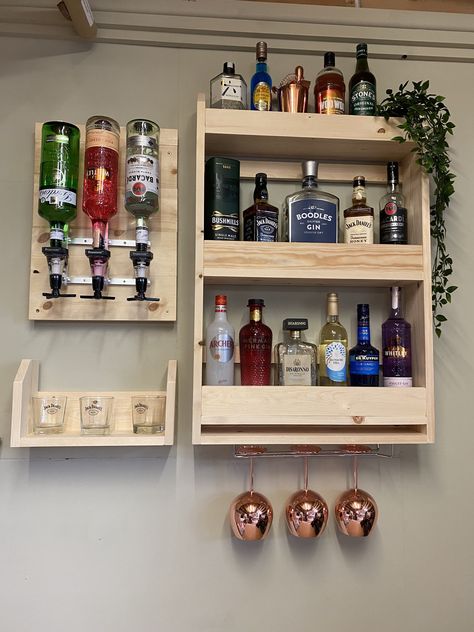 Handcrafted spirits optics plaque bar with shelves for glasses and additional bottle display Made from solid redwood pine Photo is made up of the following combination Bottle rack 900mm high 600mm long 140mm deep 1 x optic plaque (holds 3 optics) 590mm high 370mm long 40mm deep Shelf 200mm high 370mm long 140mm deep This photo shows the drinks bar in natural pine Available stains Beeswax ,dark oak ,medium oak ,dark jacobean ,antique pine ,light oak ,chestnut ,rosewood ,natural pine finish Design Wall Bar Ideas, Coffee Bar Ideas Kitchen, Coffee Bar Decorations, Kitchen Counter Coffee Bar, Coffee Bar Inspiration, At Home Coffee Bar, Counter Coffee Bar, Coffee Bar In Kitchen, Coffee Bar At Home