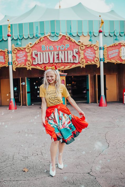 What to Wear to Disney Park | Today I'm giving you outfit ideas on what to wear during your next trip to Disney World or Land. This look is inspired by the classic movie and ride, Dumbo. Click through to get the full scoop on this look, starring this amazing circus swing skirt by Unique Vintage and a Mary Poppins-inspired graphic tee. || Vandi Fair #disney #disneyworld #disneyland #disneyfashion #disneytips #disneyoutfits #disneyparks #summerfashion #amusementpark #themepark #disneyinspired What To Wear To The Circus, Circus Photoshoot, Magic Kingdom Outfit, What To Wear To Disney, Trip To Disney World, Dumbo The Flying Elephant, Elephant Ride, Classic Disney Movies, Flying Elephant