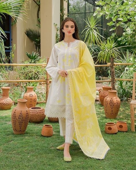 Cross Stitch on Instagram: "Channel your inner luminesce adorning the gleaming Summer Sky which features a cream shirt paste printed with illuminated yellow motifs. The attire is paired with a matching trouser and a paste printed yellow dupatta on breezy lawn fabric to make your days brighter. Summer Sky PKR 5,950 In-stores & Online ✨ #summer #intermix #cambric #crossstitchgirls #crossstitchpk #unstitched #crossstitch #cselflove #embroidered" Stitch Summer, Branded Outfits, Stitch Clothes, Cream Shirt, Unstitched Dress Material, Printed Dupatta, Black Bridal, Eid Dresses, Simple Pakistani Dresses