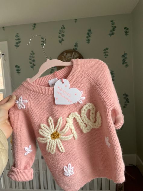 Personalized baby age sweater for first birthday in pink with flower details. Hand Embroidered by a mama owned business. Embroidered Baby Clothes, Wild Wonder, Birthday Sweater, Personalized Sweater, Birthday One, Floral Initial, First Birthday Shirts, Nursery Accessories, Buffalo New York