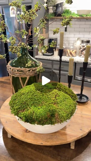 Farmshenanigans Wesley Turner on Instagram: "What Do You Think? These sell for hundreds but you can make your own. Comment Below “I need supplies” and I’ll send you everything I used. 
.
Tips: 
-Wetting your moss can help make it more pliable and easier to work with. 
-Use scissors to cut off the back of the moss if it is too thick or if you need to change shape. 
-Rolling the edges of the moss really makes a difference! 
-Use Sheet Moss for the base and any type of fluffy moss for the second layer to create the mound. 
-
- This is such an easy way to give your decor a high end design look" Moss In Potted Plants, Diy Moss Planter, Moss In Planters, Moss Pots Ideas, Moss Flower Arrangements Wedding, Moss Balls Decor Centerpieces, Moss Floral Arrangements, Moss Vases, Moss Centerpieces Diy