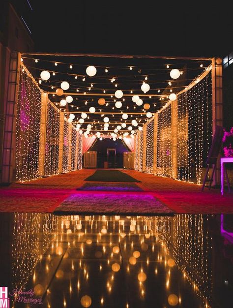 Mandap Decor With Lights, Wedding Entrance Light Decor, Wedding Decorations Night Outdoor, Outdoor Wedding Stages, Wedding Main Entrance Decoration, Function Hall Entrance Decoration, Lighting Wedding Outdoor, Sangeet Decoration Stage Outdoor Night, Outdoor Indian Wedding Decor Night