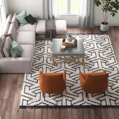 This shag area rug features breezy geometric patterns that add a fresh, boho feel to your space. It's power-loomed from polyester, so it stands up to everyday use, and it has a jute backing. The distressed beige and black color palette gives this rug a faded, lived-in look, while the fringe accents add an extra layer of texture. We love how the high 0.79" pile height makes it a plush foundation in low-traffic areas like the bedroom or nursery. Plus, to prevent this rug from shifting and sliding, Black And Cream Rug, Room Pic, Black Color Palette, Cozy Rugs, Beige Area Rug, Gray Area Rug, Dark Gray Area Rug, Shag Area Rug, Black Area Rugs