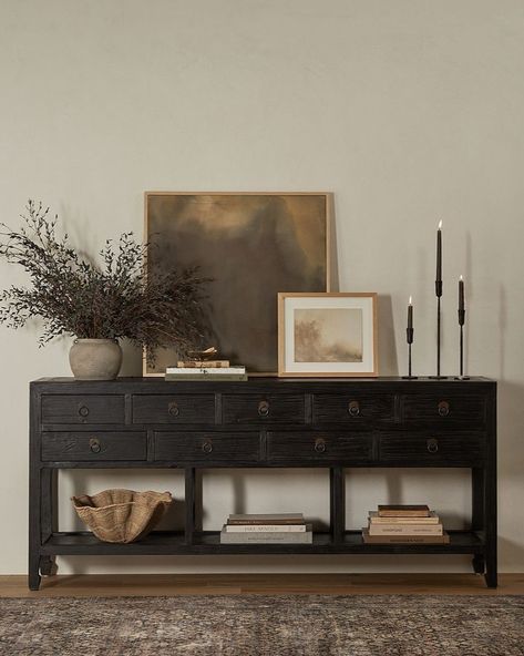 Shoppe Amber Interiors | Introducing the oh-so-charming Daniel Sideboard. Featuring a distressed black finish and nine drawers for ample storage and display, this… | Instagram Dining Room Black Buffet, Rustic Sideboard Decor, Amber Interiors Console Table, Black Dresser Living Room, Black Table Entryway, Sideboard Buffet Styling, Styling Sideboard Living Rooms, Sideboard Entryway Decor, Styling Dark Furniture