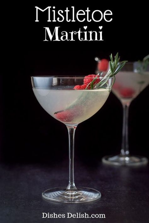 The combination of vodka and cherry brandy with the sweet and sour flavors gives this mistletoe martini a special taste that continues to satisfy with each sip. Some cocktails are made prettier by the garnish and this is one of them! #martini #cocktail #drink #dishesdelish via @dishesdelish Margaritas, Mistletoe Martini Recipe, Mistletoe Martini, Holiday Martinis, Christmas Martini, Cherry Brandy, Martini Recipe, Festive Cocktails, Winter Cocktails