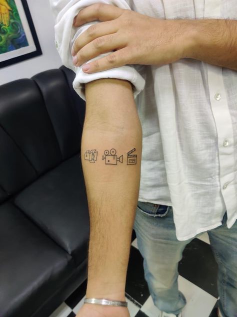 Film Clapper Tattoo, Video Editor Tattoo Ideas, Videography Tattoo Ideas, Film Lover Tattoos, Small Tattoos Camera, Film Tattoos Ideas, Lights Camera Action Tattoo, Small Film Tattoo, Film Tatoos Ideas