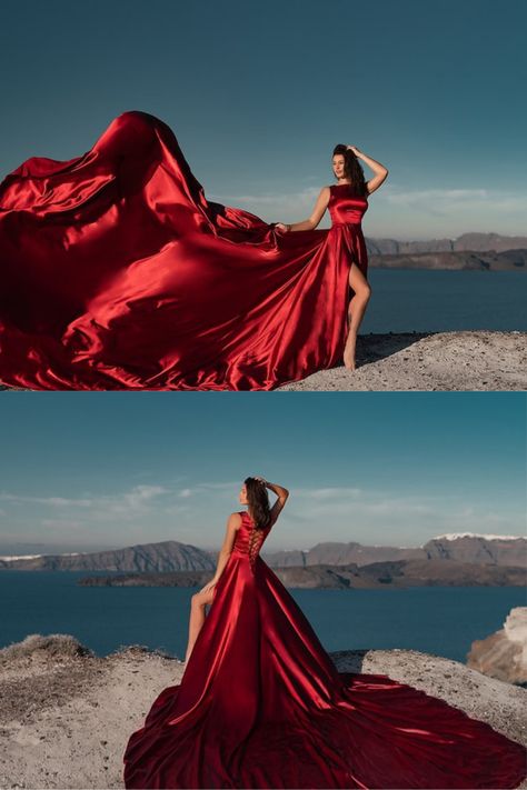 flying dress, red flying dress photoshoot, santorini dress, special occasion Long Dress For Photoshoot, Long Flowing Dresses Photography, Flowy Gown Photoshoot, Posing In A Gown, Flow Dress Photography, Red Flowing Dress, Red Satin Long Dress, Big Flowy Dress Photography, Photoshoot Gowns Dresses