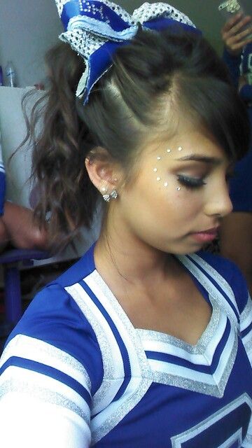 Cheer hair and makeup. Sparkles, bows, and bronzer! Cheer Dance Makeup, Cheer Pictures Makeup, Glitter Cheer Makeup, Game Day Cheer Makeup, Cheer Makeup High School Glitter, Cheer Leader Makeup, Cheer Glitter Face, Cheer Makeup Ideas, Cheerleading Makeup Ideas Glitter