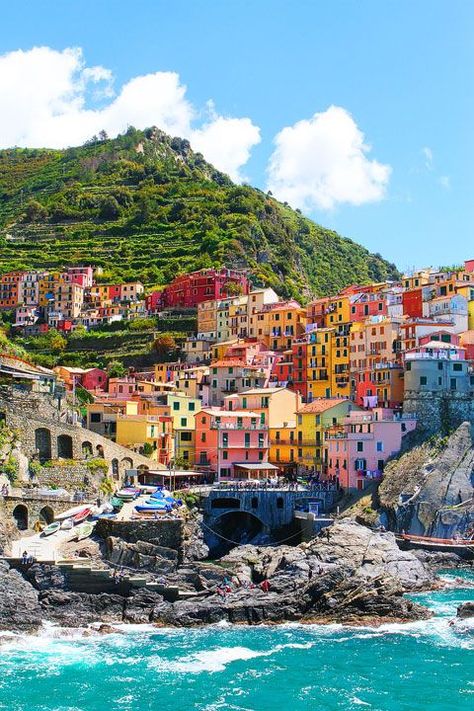 Manarola, Italy - It's in the province of La Spezia, Liguria, northern Italy. A unique place called 'Cinque Terre ' (which means Five Towns literally and this is one of the town, they are right next to each other). If you go to Tuscany, you can make a day trip there. Cinque Terre, Machu Picchu, Vatican City, Riomaggiore Italy, Italian Village, Cinque Terre Italy, La Spezia, Grand Cayman, Pretty Places