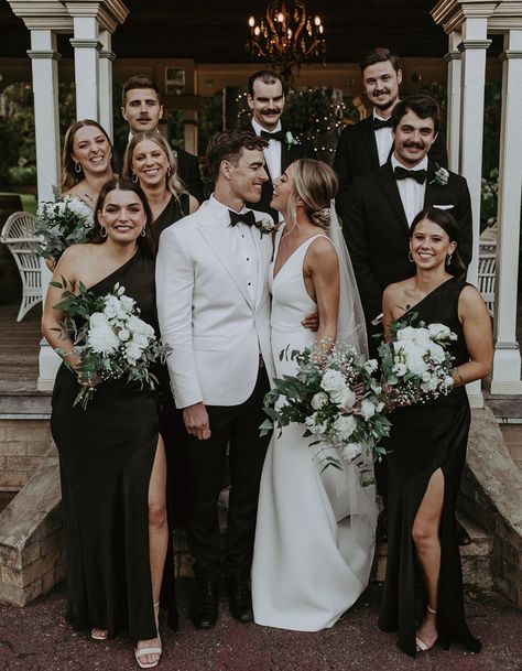 White Tux Wedding Bride Groom, Fall Wedding Black Tie, Groom Black Tie Wedding, Black White And Gold Wedding Party, Black Bridesmaid Dresses And Groomsmen, Black Wedding Bridal Party, White And Black Wedding Party, Wedding Party All Black, Black Bridesmaid And Groomsmen