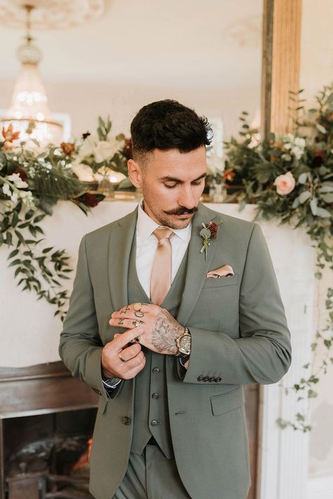 Groom in three piece green wedding suit and pink tie with matching pink pocket square Groom Green Suit Wedding, Green Suit For Groomsmen, Suit Colors For Men Wedding Spring, Sage Green Wedding Men, Green Suit Groom Wedding, Double Breasted Suit Groom, Khaki Suit With Sage Green, Men’s Spring Wedding Suit, Wedding Green Suit Groom