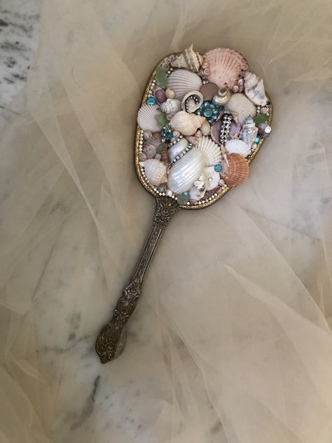 Shell Hand Mirror, She’ll Mirror, Seashell Mirror Diy, Seashell Clock, Mirror With Shells, Sea Shell Mirrors, Sea Shell Mirror, Ocean Mirror, Corpse Bride Art