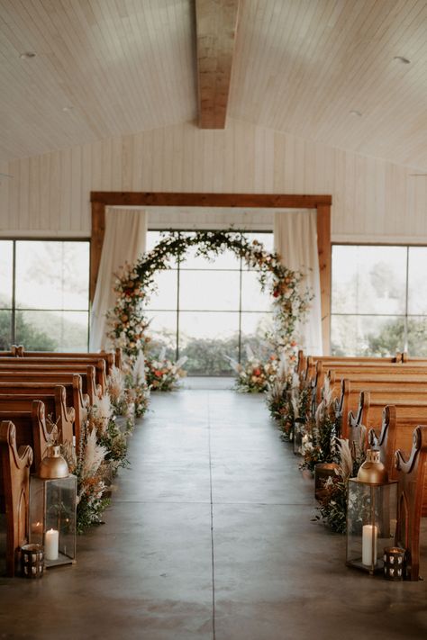 Front Of Aisle Decorations Wedding, Aisle Decorations Wedding Pew, End Aisle Decorations Wedding, Boho Chapel Wedding Decor, Lanterns Ceremony Aisle, Farm Wedding Aisle, Wedding Aisle Lanterns Indoor, Wedding Aisle Simple Outdoor, Pampas Grass Wedding Aisle Decor