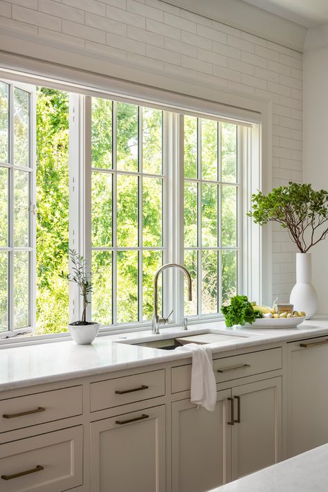 Vacation home | kitchen windows | natural lighting - Convenient, easy-to-operate casement push out windows. Discover the whole home in the link! - Architect: Amanda Orr Architects Builder: 79 West Builders Dealer: Southern Lumber and Millwork Corp. Interior Design: Means Carney Interiors Shelf In Front Of Kitchen Window, Kitchen With French Windows, Kitchen Cased Opening, Add Windows To House, Large Kitchen Sink Window, Kitchen Casement Windows Over Sink, Oven Under Window, Kitchen Wall Of Windows, Corner Windows Kitchen